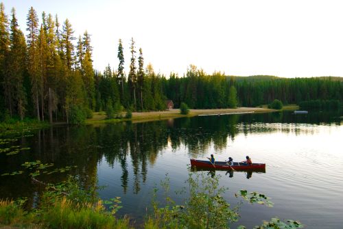 Idyllic canoe scene on Champion lakes close to Fruitvale BC